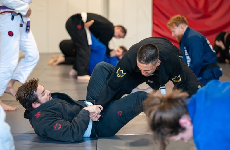 Students drilling Brazilian Jiu Jitsu techniques