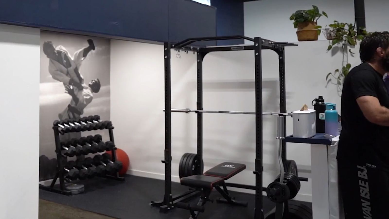 Van Isle BJJ weight room with bike