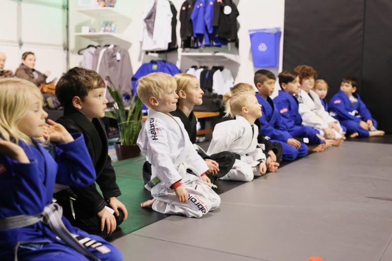Van Isle BJJ kids class lined up and listening to coach